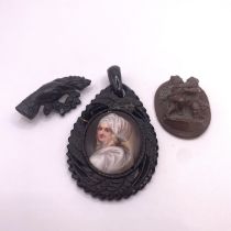 A small collection of Victorian imitation jet jewellery. Comprising a press dyed horn pendant with a