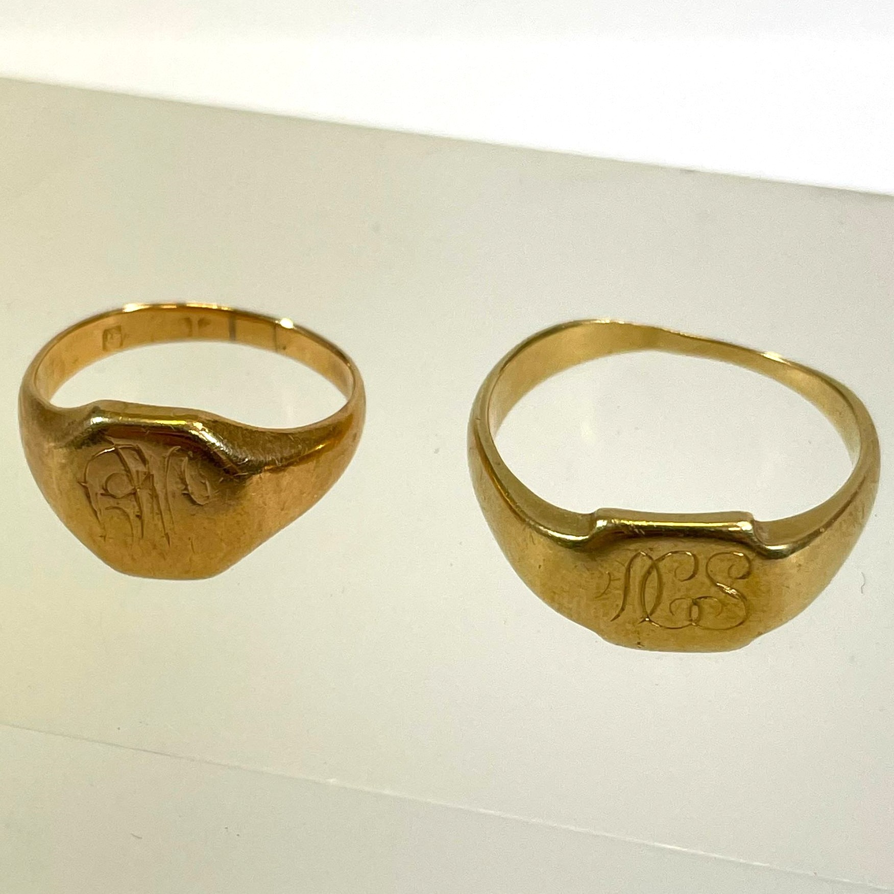Two 18ct yellow gold signet rings. Sizes M and T. Approximate total weight 13.3 grams. Wear and