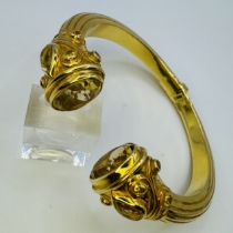A gilt-silver Indian style torc bangle, set with citrines. Design by Amrapali London, titled Shedia.