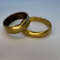 Two yellow gold band rings. Comprising a 22ct yellow gold band ring, size R, approximate weight 5.