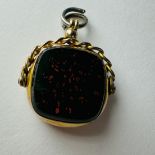 A 9ct gold spinner fob, set with bloodstone and carnelian. Hallmarked for William John Pellow,