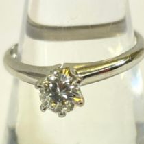 A Tiffany-style set estimated 0.46 carat diamond solitaire ring. Diamond weight of 0.46  stamped