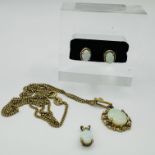 A collection of 9ct gold and white opal jewellery. Comprising a pair of hallmarked 9ct gold opal
