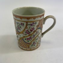 A 19th Century Famille Rose tankard. Approximately 10cm tall.  Small chip to base