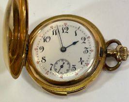 An 18ct gold ladies full hunter pocket watch. With a white enamel dial, with black and red roman