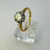 A diamond solitaire ring set with a calculated 0.80 carat round brilliant cut diamond. Set into a