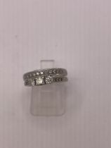 A matching set of diamond and 9ct white gold rings. Featuring a three stone diamond ring with a