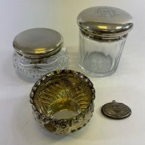 A silver embossed dish, a silver pill box and 2 silver top glass bottles.  Total weighable silver