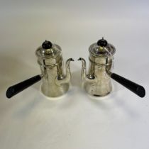 A pair of Edward VII Sterling silver chocolate pots with ebonised knop and handles. Marked for