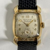 A gold filled Bulova Excellency manual wind wristwatch with a 26mm case, running, crack to glass