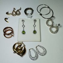 A collection of earrings A pair of 9ct white gold diamond and peridot drop earrings, approximate