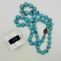 A Turquoise bead necklace with a gilt silver clasp, along with a pair of precious yellow metal