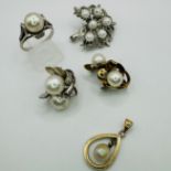 A collection of cultured pearl jewellery in yellow and white precious metal. Comprising a pair of
