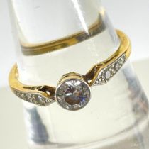 An early 20th century 0.40ct (estimated) solitaire diamond ring. With six eight cut diamonds to