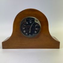 A Jaeger Paris 8 day car clock with black dial, 8.5cm diameter in wooden mahogany mantle clock