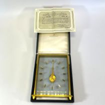 A Jaeger-LeCoultre 1968 floating skeleton mantel clock with a brushed gilt rectangle case.