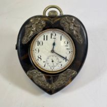A late 19th century Goliath pocket watch within a tortoiseshell fronted heart shaped case stand,