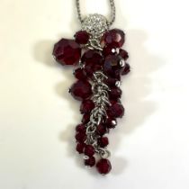 A Swarovski silver crystal pendant, featuring beads arrange to appear as grapes, along with an