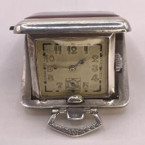 A German 800 silver Art Deco guilloche enamel folding travel clock. With a square dial with Art Deco