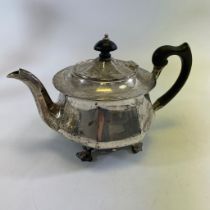 A silver teapot of stylized form with motif feet.  Sheffield 1929/30.  Sibray, Hall & Co Ltd.  (