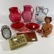 A collection various glass ceramics, collectables including two cranberry glass jugs, two glass