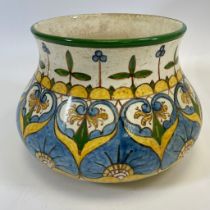 A Della Robbia style pottery squat vase.  22cm by 16cm overall.  Crazing and a hairline crack