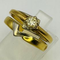 A 18ct gold bridal ring set. Featuring a 0.15 carat solitaire diamond in a raised claw