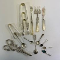 A collection of assorted silver flatware and nips.  A pair of plated grape shears and other plated
