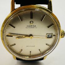 An 18K 1960s Omega Seamaster De Ville Automatic wristwatch  Featuring a champagne dial signed "Omega