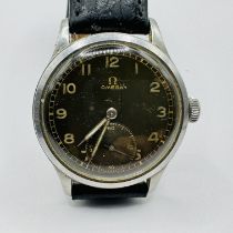 A vintage 1940s Omega wristwatch.  Brown dial with gold/luminescent Arabic numerals, subsidiary dial