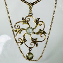 A seed pearl and aquamarine openwork spiral pendant, with a belcher chain with barrel clasp.  The