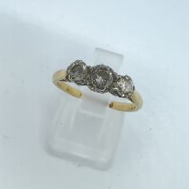 An early 20th century diamond trilogy ring, featuring an estimated total carat weight of 0.41