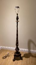 A Walnut standard lamp with gilt acanthus and vine carved gilt decoration.  170cm tall.  Generally