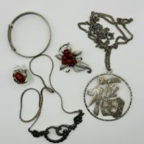 A collection of silver jewellery. To include a red coral spray brooch, marked "silver"; a red