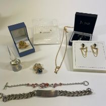 A collection of silver and costume jewellery. To include a Christalina egg pendant and chain; a mens