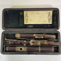 A 19th Century Flute, probably Cocuswood, in original box stamped Rudall & Rose No 1 Tavistock