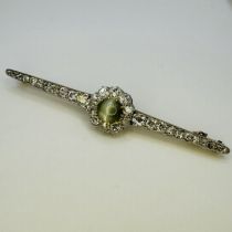 A Belle Epoque cats eye Chrysoberyl and diamond brooch. Featuring a central round cabochon chatoyant