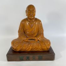 A carved wooden figure of the Japanese Grand Master Ganzan - Daishi (912-985). Approximately 37cm by