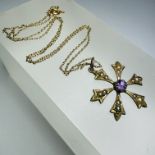 A seed pearl and amethyst snowflake pendant and chain. The pendant is set with a central round cut