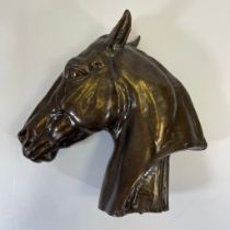 A bronze horses head after Albert Hinrich Hussmann (1874-1946) no. 1697/1.  29cm tall missing base