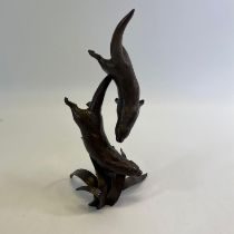 A Bronze sculpture of 2 otters attributable to Michael Simpson.  Signed M.S on the bottom and serial