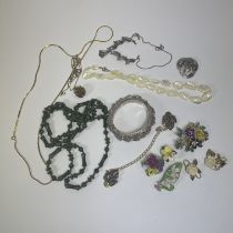 A collection of jewellery to include a silver filigree floral bracelet with safety chain, 8