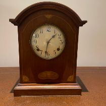 An Edwardian inlaid mahogany mantel clock striking on a gong. Approximately 28cm by 28cm by 15cm