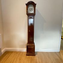 A 1930s mahogany chiming granddaughter clock with Westminster, Winchester and Whittington chimes,