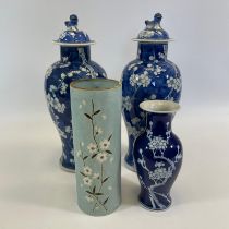 A pair of Chinese blue and white lidded vases with four character marks to base. Approximately