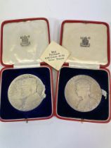 Two Royal Mint (silver colour and matt finish) commemorative medallions (1910-1935) and a 1937