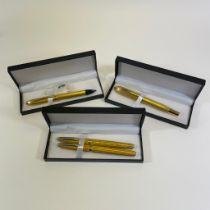 A collection of Thomas Lyte and Cross pens. Comprising a yellow enamelled sterling silver Thomas