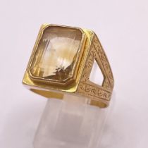 A Chinese precious yellow metal gentleman's signet ring. Engraved with foliate patters and set