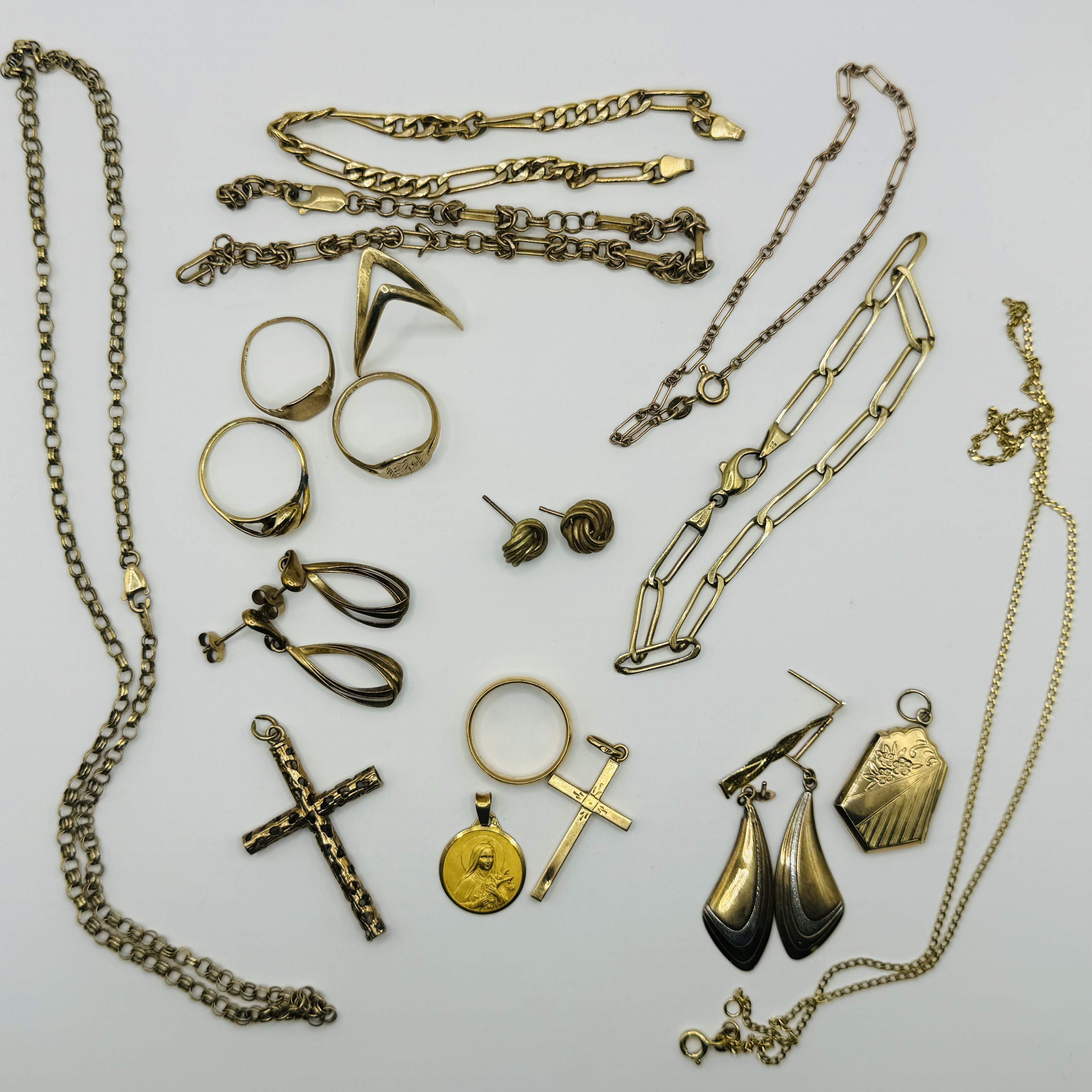 A collection of gold jewellery. To include four 9ct hallmarked gold rings, earrings, chains (some as
