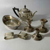 A collection of sterling silver featuring a George VI Mappin and Webb Queen Anne style teapot. Plus